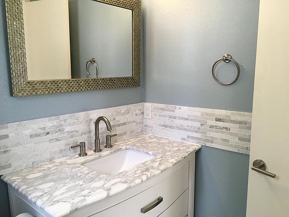 Hall 1/2 Bath just inside front door of house. This is on the top floor.