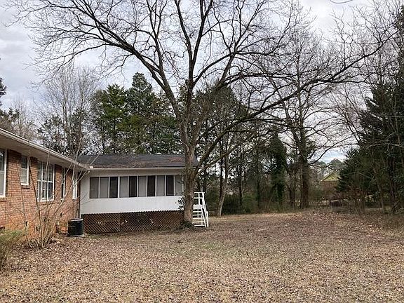 Large screened porch overlooks private backyard.