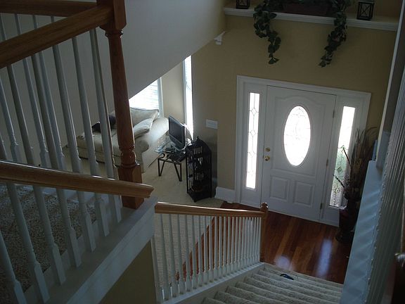 upstairs staircase looking into foyer