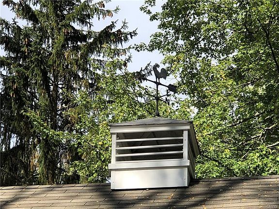 Charming cupola on top of the garage.