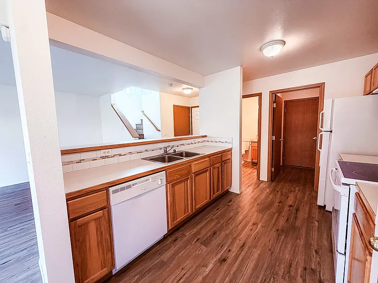 Kitchen with view of laundry room and door to garage