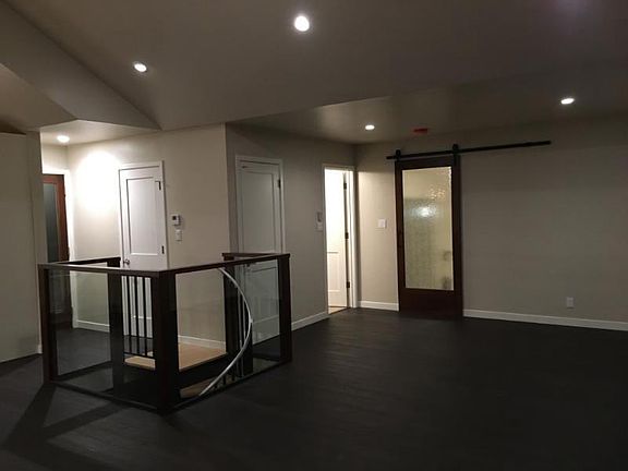 Main living space, doors to upper bathroom and bedroom.