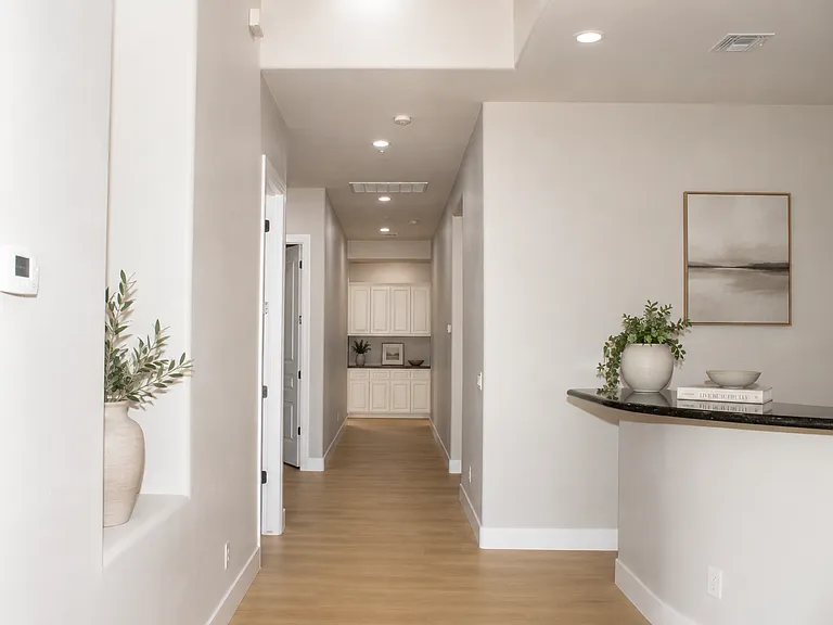 Guest Wing Hallway _ Access to Guest Bedrooms, Laundry & Powder Room-Virtually Staged
