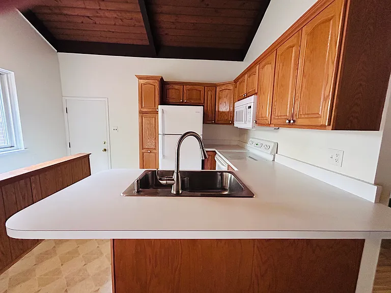 Kitchen with door into double garage