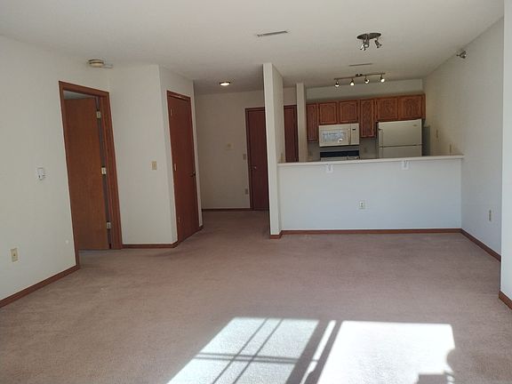 Entrance to Apartment, Kitchen, & door to Bedroom