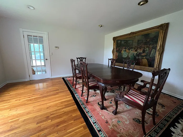 Dining room with furniture / photo facing toward kitchen behind glass door