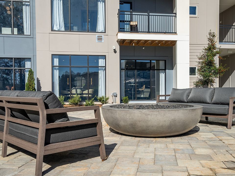 Experience luxury and relaxation in this sleek, modern outdoor living area.