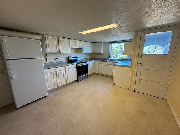 Kitchen with large window facing garden