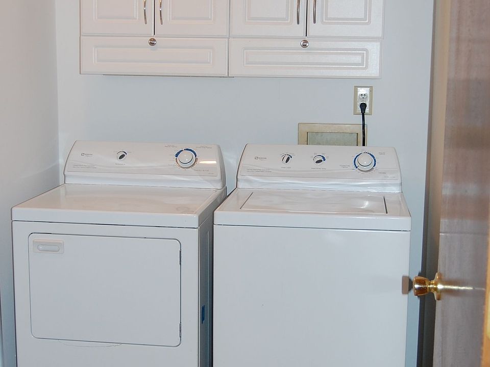 Tile and Cabniets added in laundry room