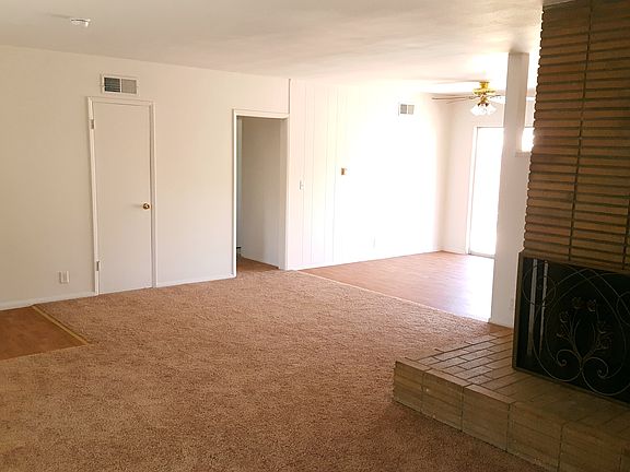 Living room looking in to Dining room which has a sliding gl