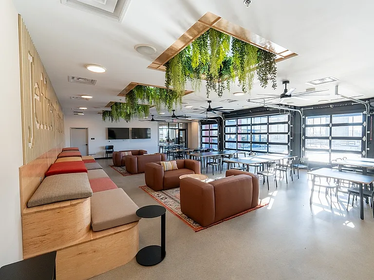 Experience relaxation in this stylish lounge, complete with natural light and elegant design.