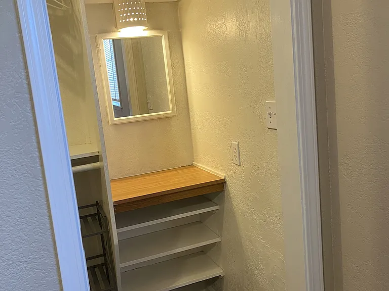 walk-in closet includes vanity