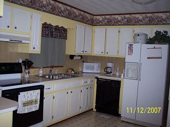 Kitchen has dishwasher, Range and hood, Hotpoint Side by side