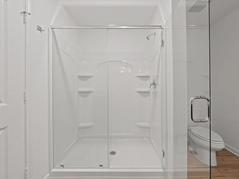 A step-in shower in the master bathroom.