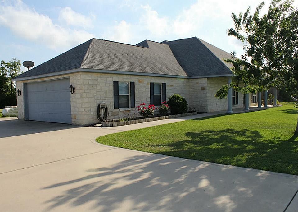 Front of home. Extra wide driveway.