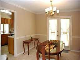 Formal Dining Room w/ French doors leading to patio 