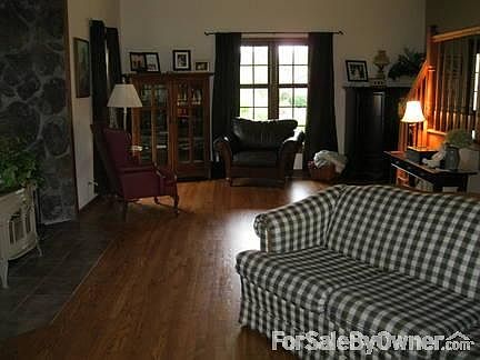 Great Room 27 x 16
						:
						Oak hardwood floors, cathedral ceiling, Vermont Casting woodburning stove.