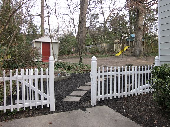 Backyard playhouse and storage shed to match house colors