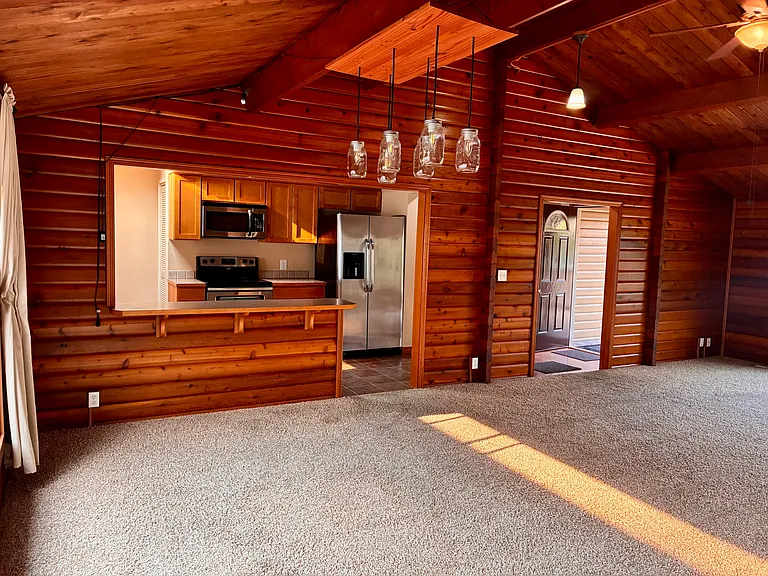 Entry, breakfast bar, kitchen.