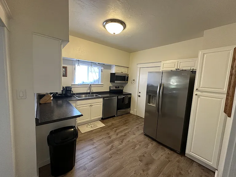 The kitchen is located on the main level and comes fully equipped with all necessary appliances.