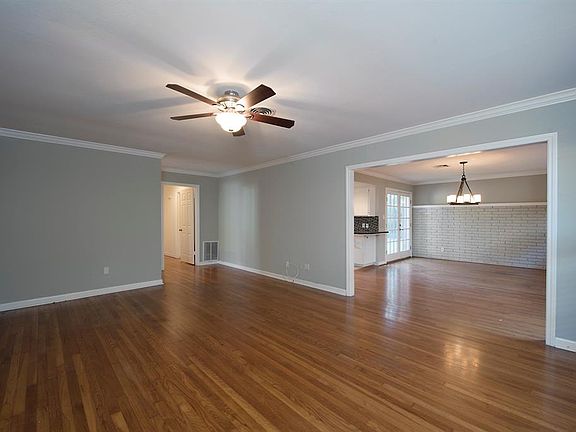 Large front room leads to dining and kitchen