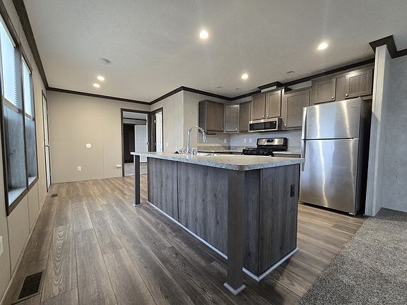2nd image of 7204 E Grand River Ave #320