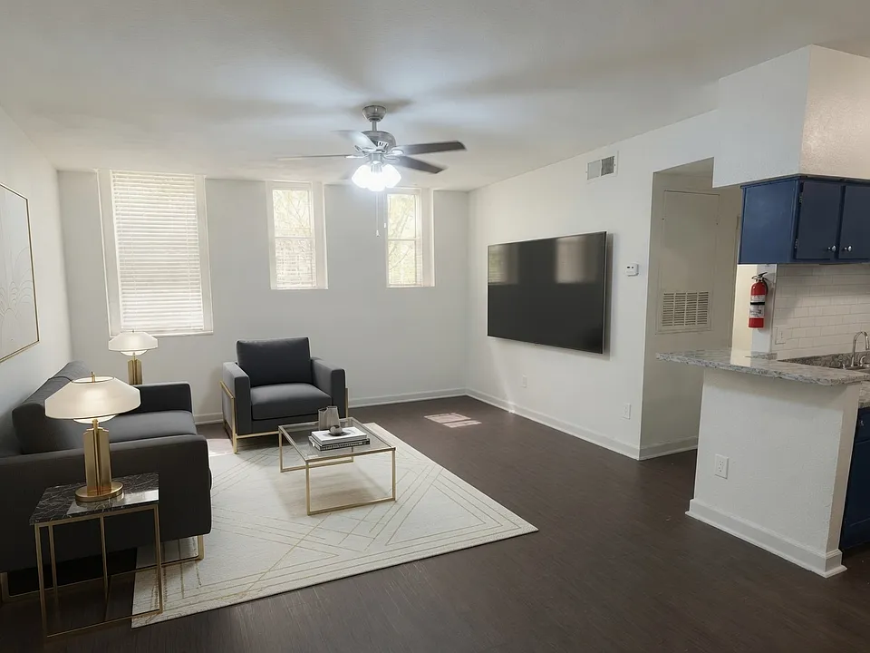 Spacious living room with extra tall ceilings makes movie night and hanging out with friends that much better.