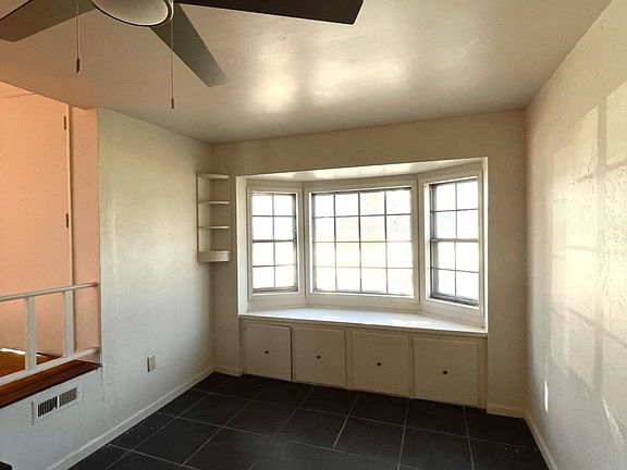 Den with bay window