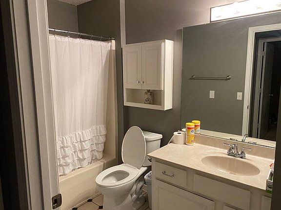Main bathroom with shower and bathtub