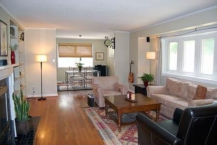 Large living room w/ bay window, gleaming hardwoods