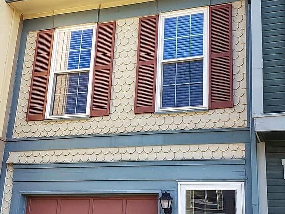 Front - 1 car attached garage and driveway