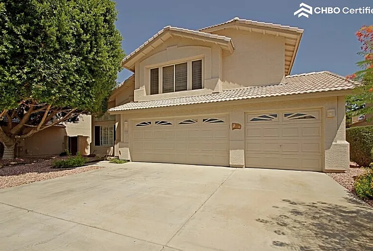 Stucco and Spanish tile architecture with thr