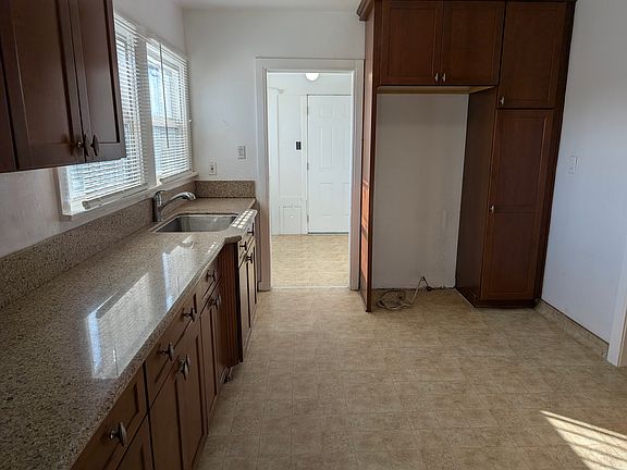 Kitchen with custom cabinets and countertops.