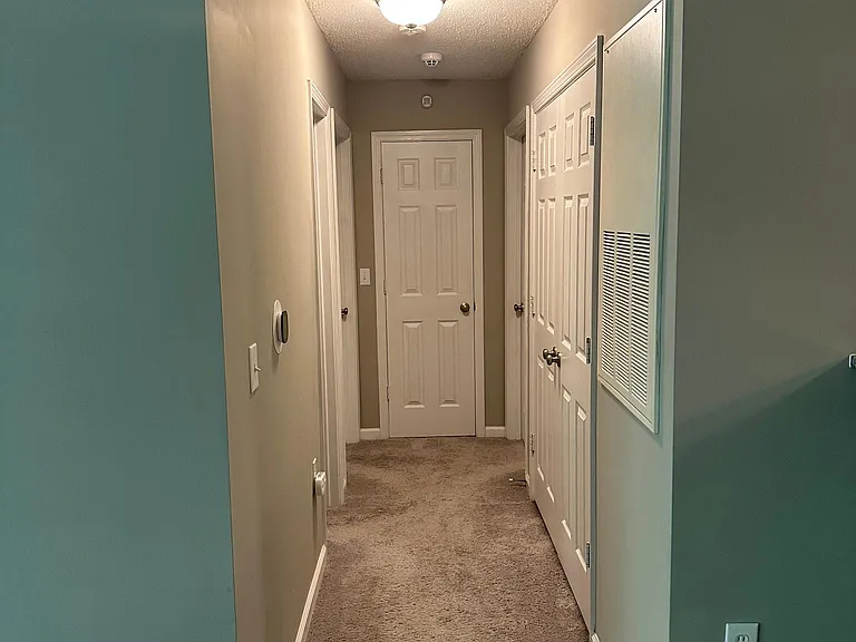 Hall Leading to Laundry Closet on R, Bedrooms on Both Sides