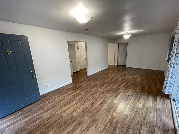 Living Area w/ hallway, 1st Bedroom