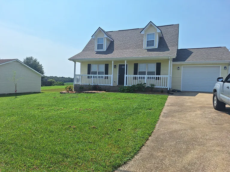 Front of house with garage and new electric garage door opener to keep your vehicle out of the elements!
