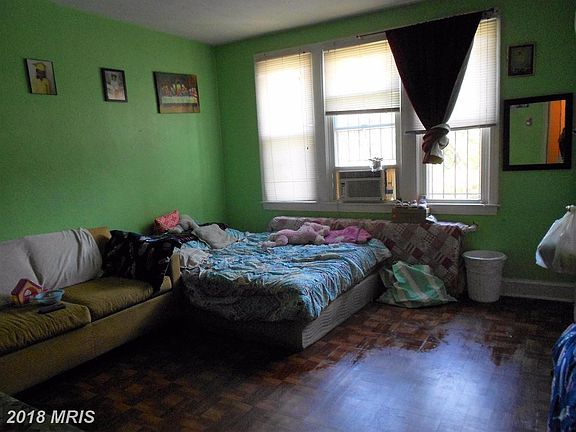 Unit 1 living room (used as a sleeping area)