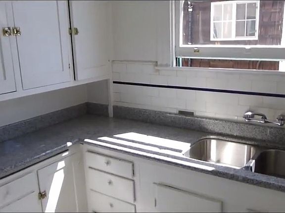 KITCHEN W/ GAS STOVE AND REFRIGERATOR