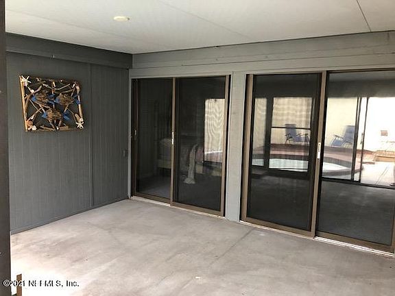 Glassed in Porch off Primary Bedroom with Sliders