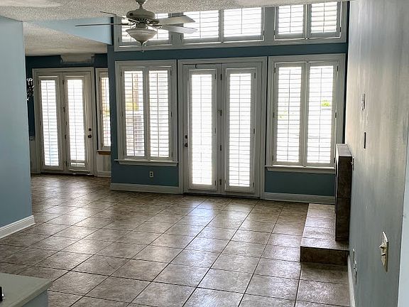 View of living room from front door. This home has quite a bit of natural light in the living room.