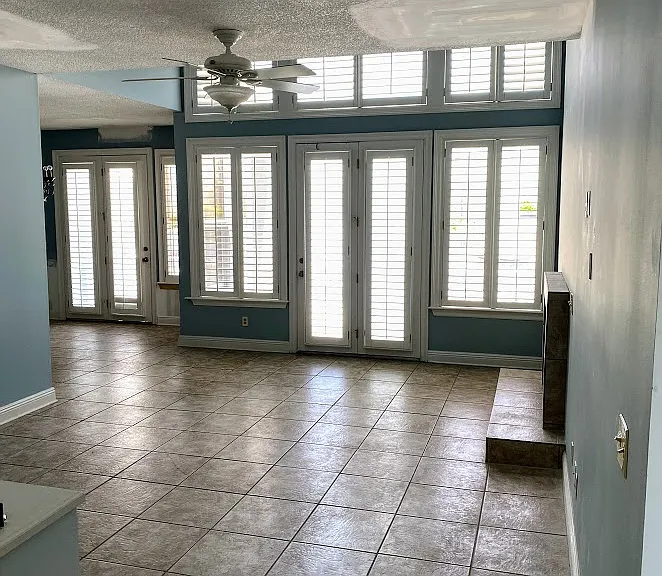 View of living room from front door. This home has quite a bit of natural light in the living room.