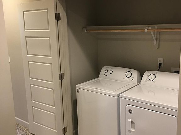 Washer and dryer located upstairs between the two room.