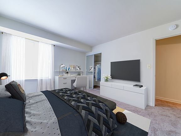 Bedroom with walk-in closet