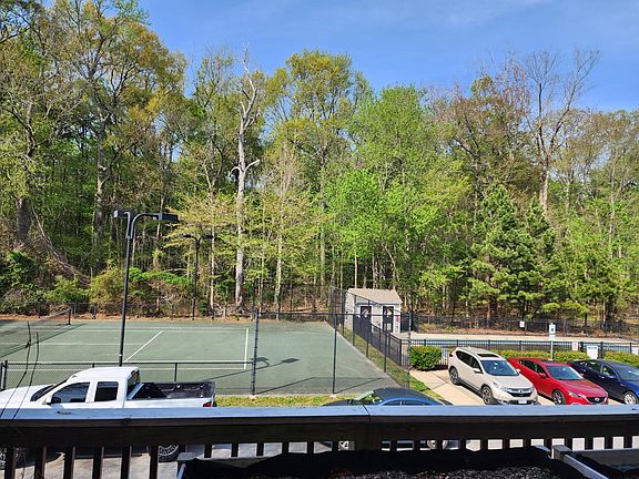 Second floor deck overlooks tennis court and pool area.