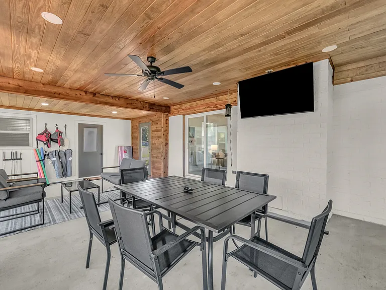 6 person dining table in the screen in porch and a comfy 4 person table perfect for views, coffee or games! Smart TV to watch the big game while grilling all your favs.