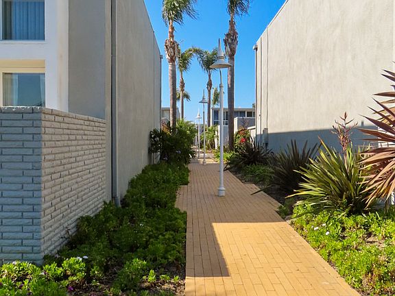 Outdoor walkway between condos