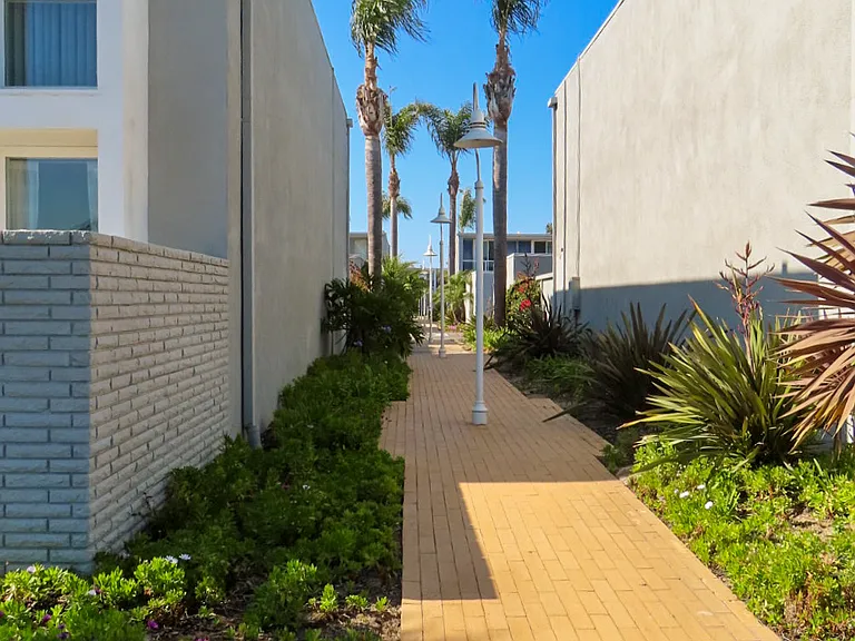Outdoor walkway between condos