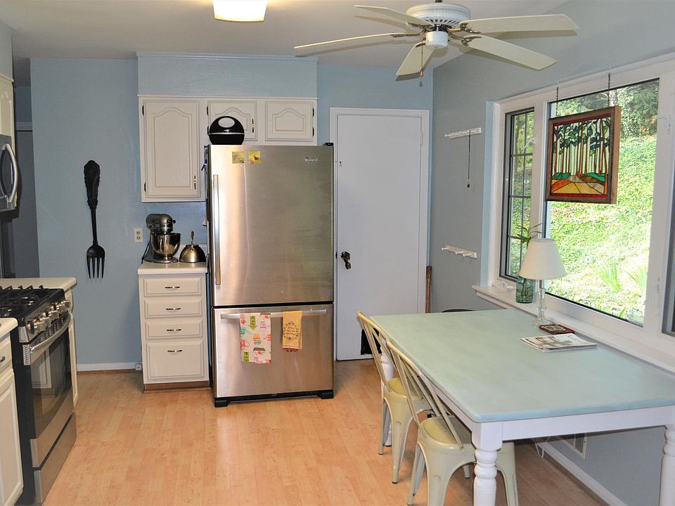 Kitchen with view of fenced backyard
