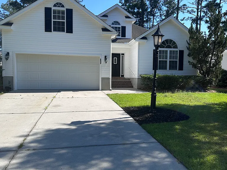 8825 Wadsworth Dr NW — Photo 1