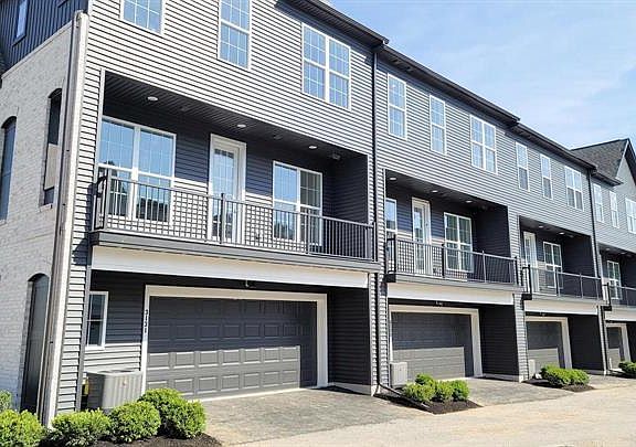 Back of the house with 2 car garage
